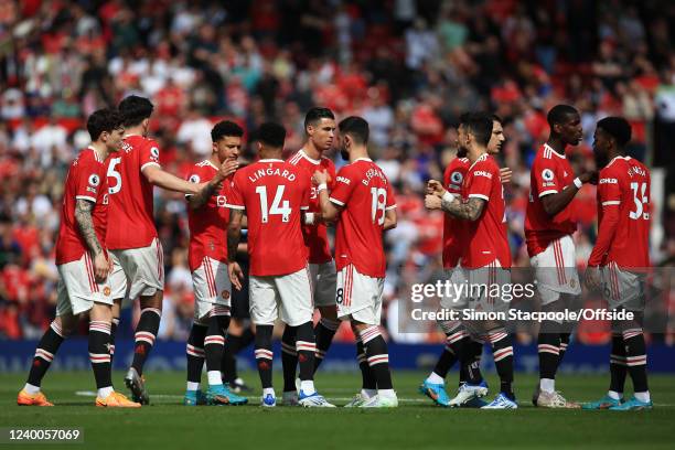 Manchester United players encourage each other before the Premier League match between Manchester United and Norwich City at Old Trafford on April...