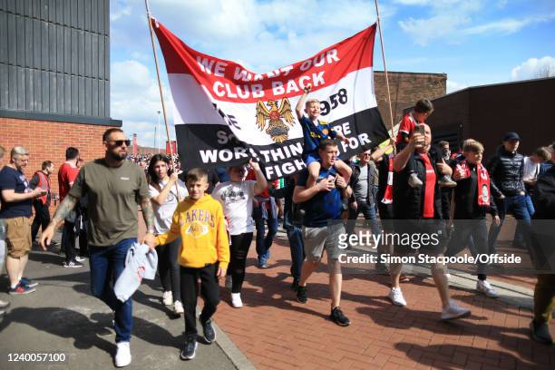Manchester United fans take part in a protest against the club's owners, the Glazers, before the Premier League match between Manchester United and...