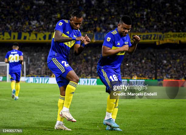 Sebastian Villa of Boca Juniors celebrates with teammate Frank Fabra after scoring the first goal of his team during a match between Boca Juniors and...