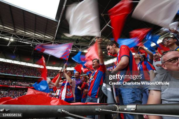 Palace fans wave their flags during The FA Cup Semi-Final match between Chelsea and Crystal Palace at Wembley Stadium on April 17, 2022 in London,...