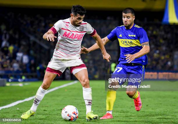 Lautaro Acosta of Lanus drives the ball during a match between Boca Juniors and Lanus as part of Copa de la Liga 2022 at Estadio Alberto J. Armando...