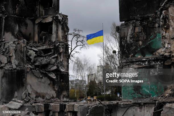 Ukrainian flag flys in a damaged residential area in the city of Borodyanka, northwest of the Ukrainian capital Kyiv. In Borodyanka in the Kiev...