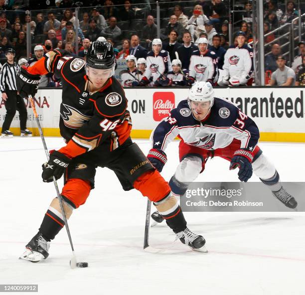 Trevor Zegras of the Anaheim Ducks and Cole Sillinger of the Columbus Blue Jackets battle for position during the third period at Honda Center on...
