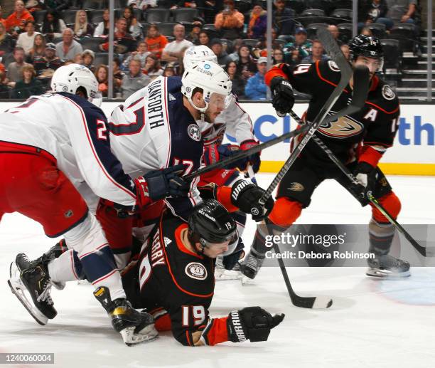 Troy Terry of the Anaheim Ducks gets pushed to the ice during the third period against the Columbus Blue Jackets at Honda Center on April 17, 2022 in...