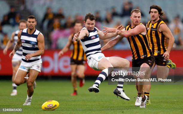 Patrick Dangerfield of the Cats and Tom Mitchell of the Hawks compete for the ball during the 2022 AFL Round 05 match between the Hawthorn Hawks and...