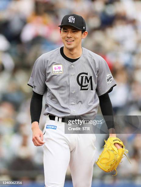 This picture taken on April 17, 2022 shows Lotte Marines pitcher Roki Sasaki smiling during the Nippon Professional Baseball match between the Chiba...
