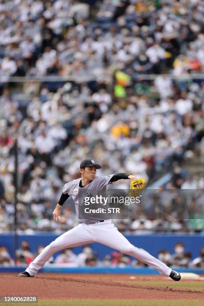This picture taken on April 17, 2022 shows Lotte Marines' Roki Sasaki pitching during the Nippon Professional Baseball match between the Chiba Lotte...