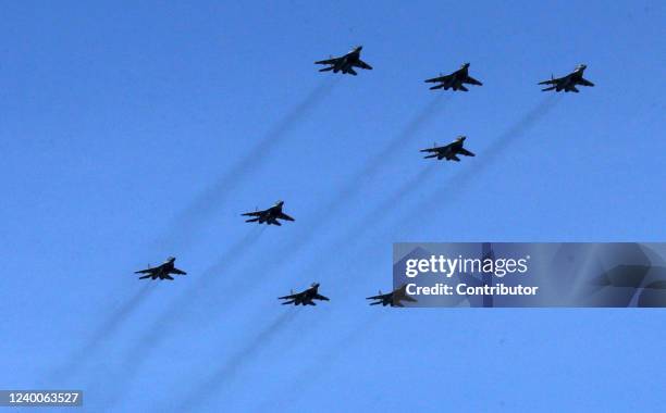 Mikoyan MIG-29 jet fighters show the letter "Z", a symbol of the Russian military invasion of Ukraine, over the polygon during the parade rehearsals,...