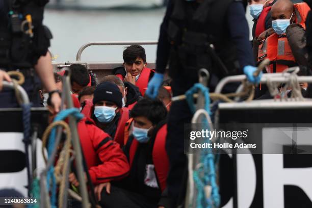 Migrants arrive at Dover Marina after being picked up by the border force on April 18, 2022 in Dover, England. Migrants have continued to arrive on...