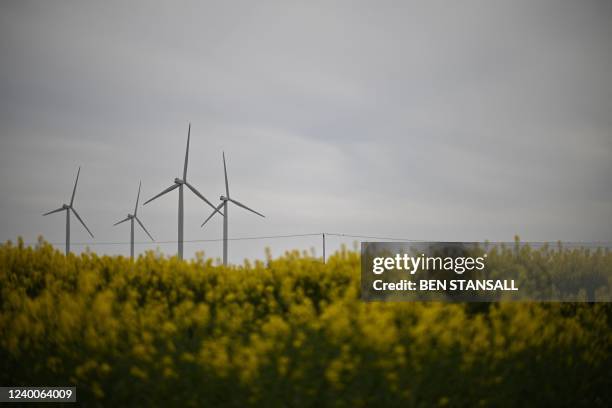 Photograph taken on April 18, 2022 shows wind turbines at the Little Cheyne Court Wind Farm, in Romney Marsh, south east England. - Little Cheyne...