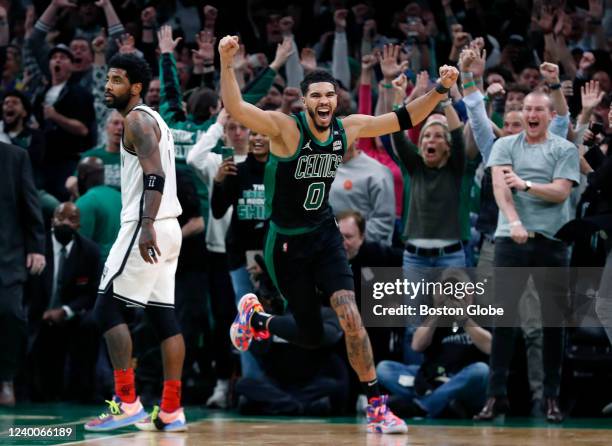 The Celtics Jayson Tatum as well as the fans erupt after his basket at the buzzer defeated Kyrie Irving and the Nets 115-114. The Boston Celtics...