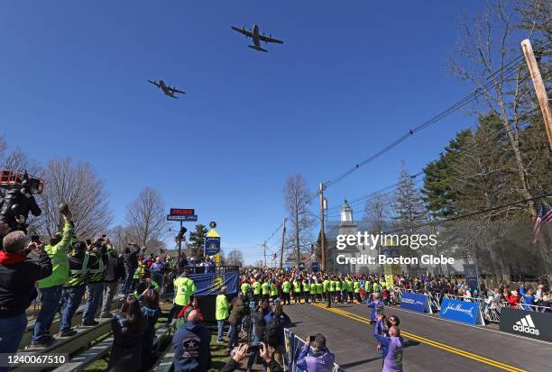 Hopkinton, MA C 130's fly over at the starting line of the 126th Boston Marathon in Hopkinton, MA on April 18, 2022.