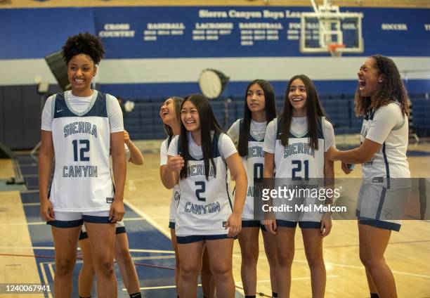 Left to right-Juju Watkins, Kayla Malek, Nataha Bay, Christy Reynoso, Sofia Ruelas, and Leia Edwards react to a teammate being photographed during...