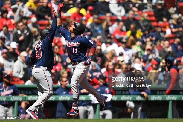 Jorge Polanco of the Minnesota Twins celebrates with third base coach Tommy Watkins after hitting a two run home run in the third inning against the...