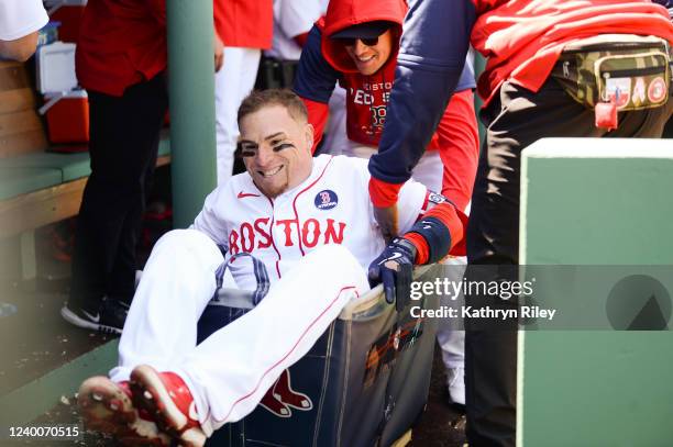 Christian Vazquez of the Boston Red Sox takes a ride in the laundry cart after hitting a solo home run in the seventh inning against the Minnesota...