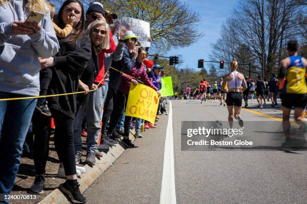 Newton, MA Spectators watch and cheer as runners reach the beginning of Heartbreak Hill during the 126th running of the Boston Marathon in Newton, MA...