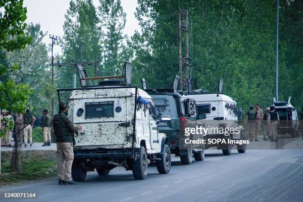 Indian armoured vehicles seen parked near the attack site at Kakapora railway station in south Kashmir's Pulwama district where a railway protection...