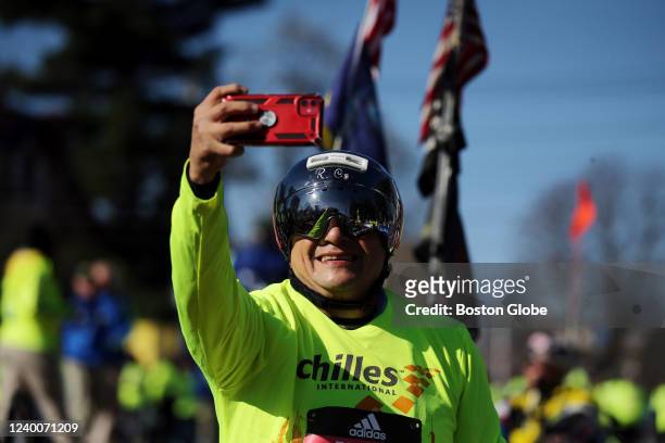 Ricardo Corral makes a selfie before the start of the handcycling heat of the 126th Boston Marathon in Hopkinton, MA on April 18, 2022.