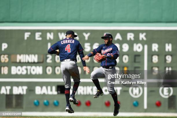 Carlos Correa and Gilberto Celestino of the Minnesota Twins celebrate after beating the Boston Red Sox at Fenway Park on April 18, 2022 in Boston,...