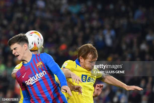 Barcelona's Spanish midfielder Gavi vies with Cadiz's Uruguayan defender Pacha Espino and Cadiz's Spanish midfielder Alex Fernandez during the...