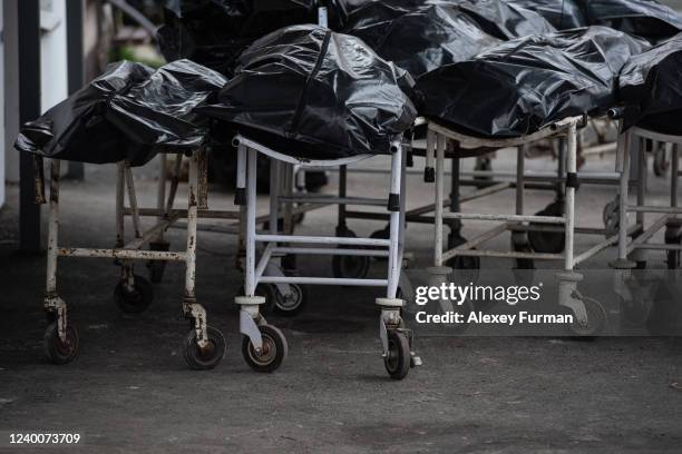 Body bags are seen by the morgue building on April 18, 2022 in Bucha, Ukraine. The Kyiv suburb was heavily damaged in fighting between invading...