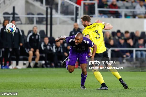 Orlando City forward Tesho Akindele and Columbus Crew defender Josh Williams battle for the ball in a match between the Columbus Crew and Orlando...