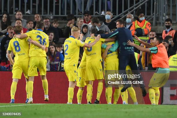 Cadiz's players celebrate after Spanish forward Lucas Perez scored a goal during the Spanish League football match between FC Barcelona and Cadiz CF...