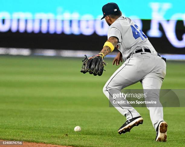 Detroit shortstop Harold Castro can't handle a hard hit ball for an error during a Major League Baseball game between the Detroit Tigers and the...