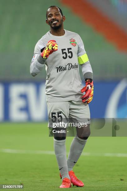 Shabab's goalkeeper Majed Naser celebrates his team's goal during the AFC Champions League group C match between UAE's Shabab Al-Ahli and Qatar's...