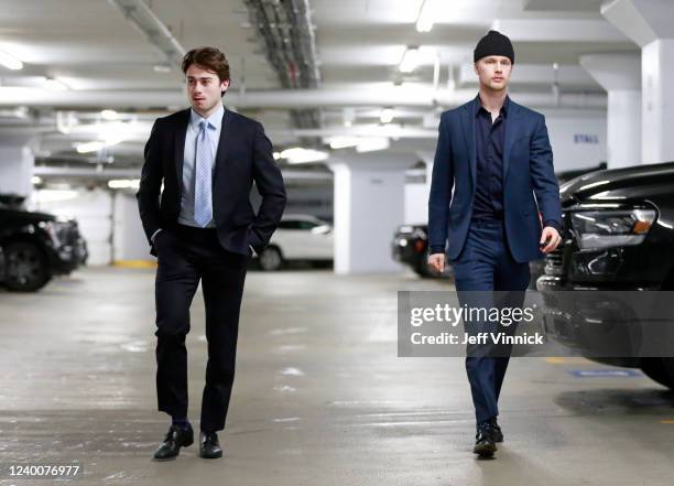 Quinn Hughes and Elias Pettersson of the Vancouver Canucks walk to the Canucks dressing room before their NHL game against the Dallas Stars at Rogers...