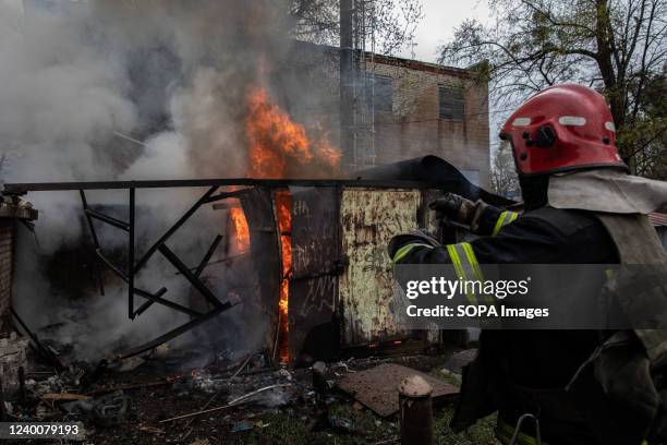 Firefighter seen at the garage hit by a Russian artillery strike in Kharkiv. Following Russia's renewed offensive on the eastern part of Ukraine,...