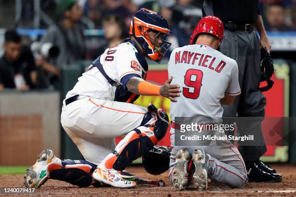 Jack Mayfield of the Los Angeles Angels reacts after being hit by a pitch during the game between the Los Angeles Angels and the Houston Astros at...