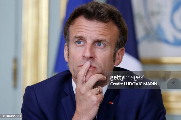France's President Emmanuel Macron takes part in an expanded videoconference with the Quint group, including the United States, Japan, Canada,...