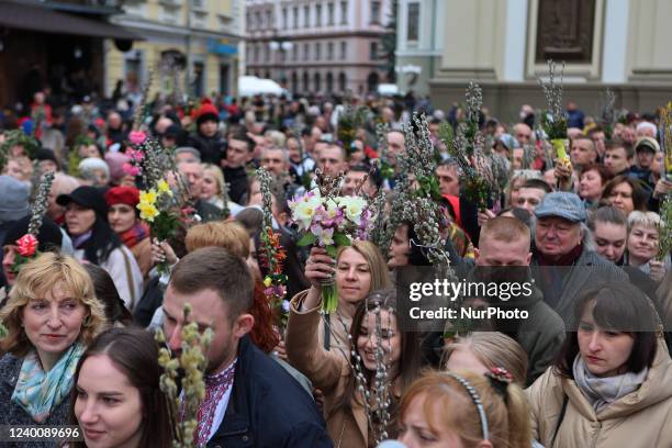 People hold willow bouquets during the consecration ceremony outside the Cathedral of the Resurrection of Jesus Christ of the Ukrainian Greek...