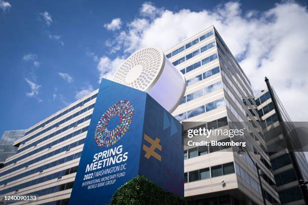 International Monetary Fund and World Bank spring meetings signage outside the IMF headquarters in Washington, D.C., U.S., on Tuesday, April 19,...