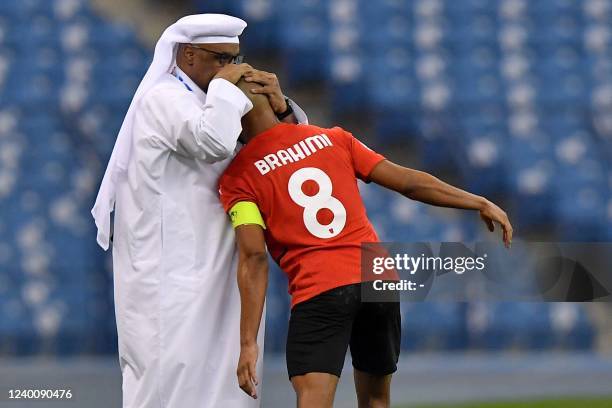 Rayyan's midfielder Yacine Brahimi celebrates with his team after scoring the third goal during the AFC Champions League group A match between...