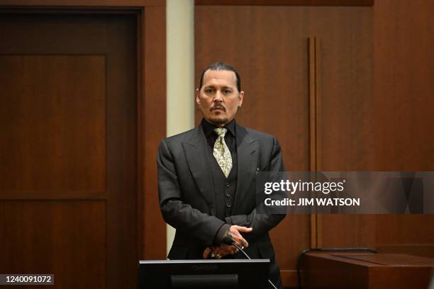 Actor Johnny Depp testifies during his defamation trial in the Fairfax County Circuit Courthouse in Fairfax, Virginia, on April 19, 2022. - Depp is...