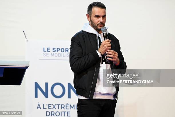 French athlete Mehdi Baala speaks as athletes, sport representatives and politicians gather to fight against far-right at the judo institute in...