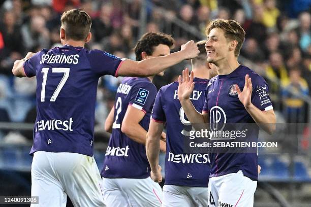 Toulouses French defender Anthony Rouault is congratulated by Toulouses Dutch midfielder Stijn Spierings after he scored a goal during the French L2...