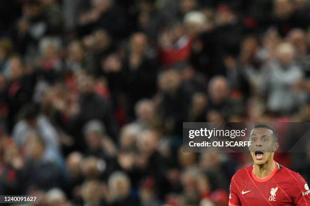 Liverpool's Spanish midfielder Thiago Alcantara reacts during the English Premier League football match between Liverpool and Manchester United at...