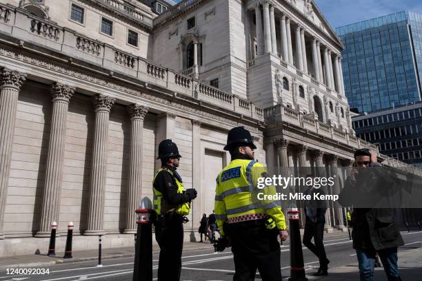 City police outside the Bank of England in the City of London on 11th April 2022 in London, United Kingdom. The City of London is a city, ceremonial...