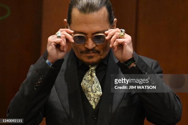 Actor Johnny Depp testifies during his defamation trial in the Fairfax County Circuit Courthouse in Fairfax, Virginia, on April 19, 2022. - Depp is...