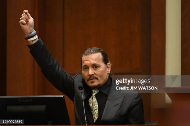 Actor Johnny Depp testifies during his defamation trial in the Fairfax County Circuit Courthouse in Fairfax, Virginia, on April 19, 2022. - Depp is...