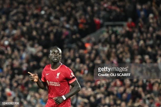 Liverpool's Senegalese striker Sadio Mane celebrates after scoring his team third goal during the English Premier League football match between...