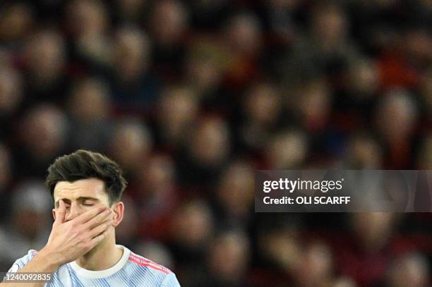 Manchester United's English defender Harry Maguire reacts during the English Premier League football match between Liverpool and Manchester United at...