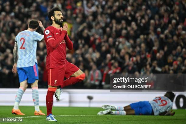 Liverpool's Egyptian midfielder Mohamed Salah celebrates after scoring his team fourth goal during the English Premier League football match between...