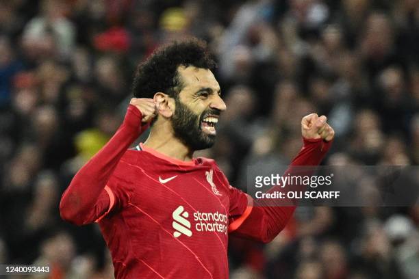 Liverpool's Egyptian midfielder Mohamed Salah celebrates after scoring his team fourth goal during the English Premier League football match between...