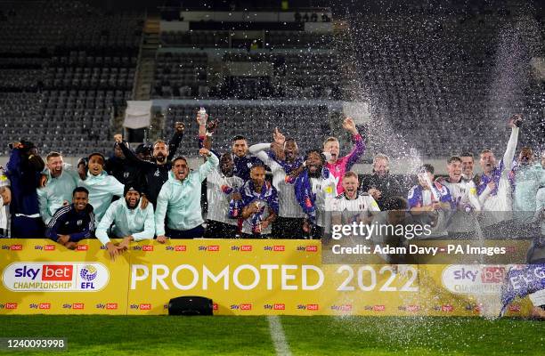 Fulham celebrate promotion to the Premier League after the Sky Bet Championship match at Craven Cottage, London. Picture date: Tuesday April 19, 2022.
