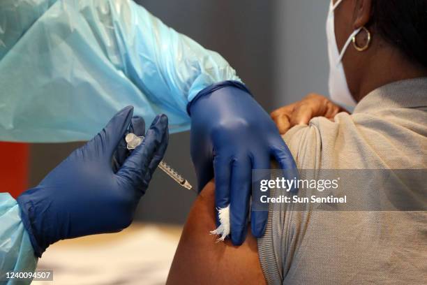 Woman receives the COVID-19 vaccine in this file photo.