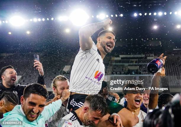 Fulhams Aleksandar Mitrovic celebrates promotion to the Premier League after the Sky Bet Championship match at Craven Cottage, London. Picture date:...